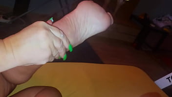 The stepmother allowed the stepson to watch as she lubricates her feet with cream