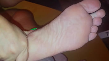 The stepmother allowed the stepson to watch as she lubricates her feet with cream