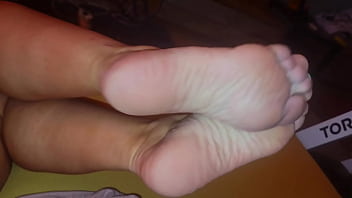 The stepmother allowed the stepson to watch as she lubricates her feet with cream