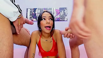 Horny brunette has oral sex with two huge cocks