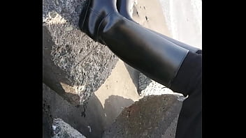 Fetish rubber boots at beach Fetish rubber boots at beach
