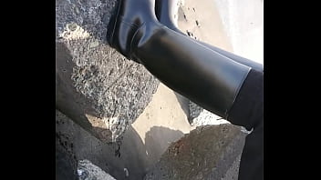 Fetish rubber boots at beach Fetish rubber boots at beach