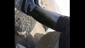 Fetish rubber boots at beach