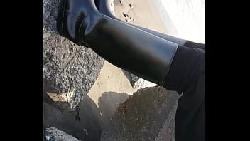 Fetish rubber boots at beach