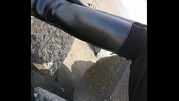 Fetish rubber boots at beach