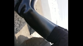 Fetish rubber boots at beach