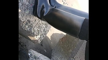 Fetish rubber boots at beach