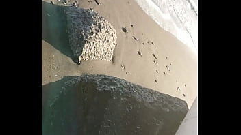 Fetish rubber boots at beach