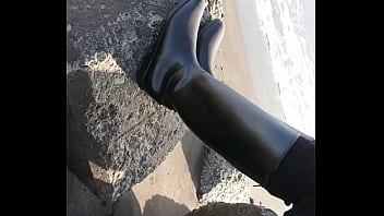 Fetish rubber boots at beach