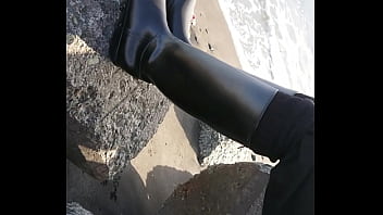 Fetish rubber boots at beach