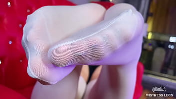 Mistress in white nylons teases you with her soles while lying on the couch Mistress in white nylons teases you with her soles while lying on the couch