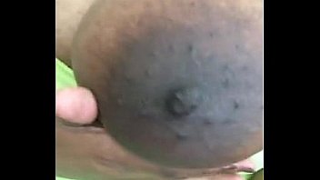 Busty ebony teen massages her tits