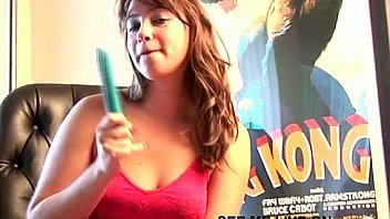 Busty brunette teen puts dildo between boobs