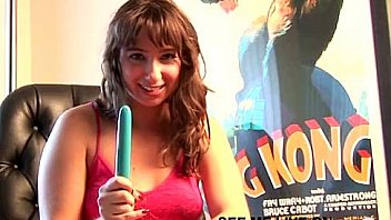 Busty brunette teen puts dildo between boobs