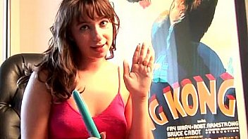 Busty brunette teen puts dildo between boobs