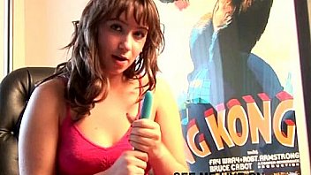 Busty brunette teen puts dildo between boobs