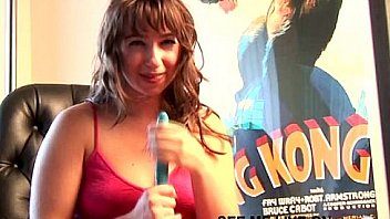 Busty brunette teen puts dildo between boobs