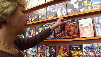 Granny fucks a guy in the video store Granny fucks a guy in the video store