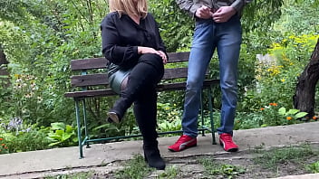 Mature milf in sexy clothes helps a man pee outdoors