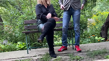 Mature milf in sexy clothes helps a man pee outdoors