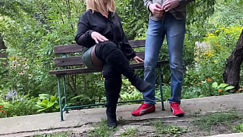 Mature milf in sexy clothes helps a man pee outdoors