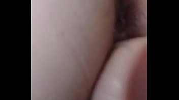 Stuffing her pussy with a big dildo