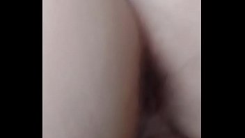 Stuffing her pussy with a big dildo