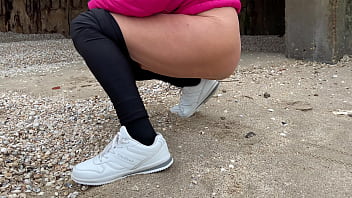 Stepmom on the beach pees and shows her ass