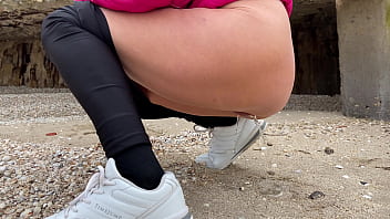 Stepmom on the beach pees and shows her ass