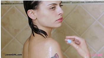 Attractive brunette model enjoys a sensual bath