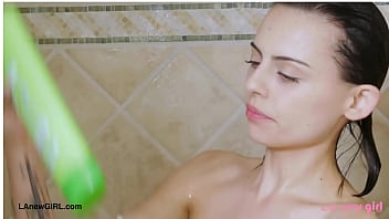 Attractive brunette model enjoys a sensual bath