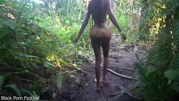 Perfect body dark skin african village girl dancing in raffia half naked outdoor
