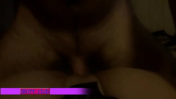 Young couple tumbling in bed