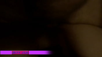 Young couple tumbling in bed