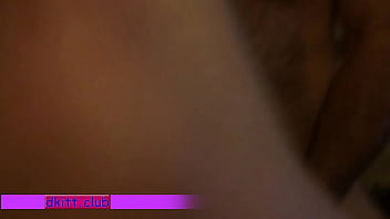 Young couple tumbling in bed