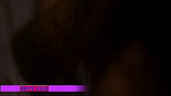 Young couple tumbling in bed