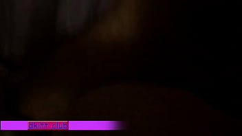 Young couple tumbling in bed