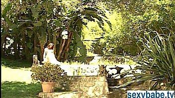 Nude brunette babe outside stripping off