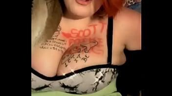 Mature busty with tattoos on her tits dances weird
