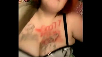 Mature busty with tattoos on her tits dances weird
