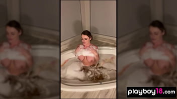Big boobed cougar fingering her neglected pussy in the bath