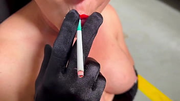 Smoking in red lipstick and satin gloves
