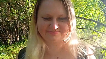 A curvy blonde in sexy gear masturbates and pisses among the trees