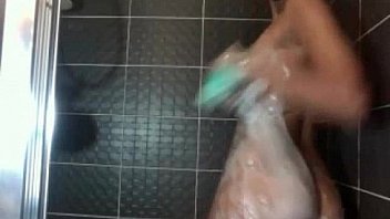 Brunette teen in the shower