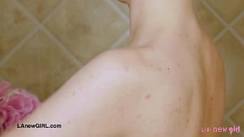 Sexy blonde model enjoys a sensual bath