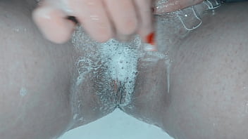 Milf shaving her pussy up close and lots of soap