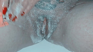 Milf shaving her pussy up close and lots of soap