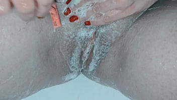 Milf shaving her pussy up close and lots of soap