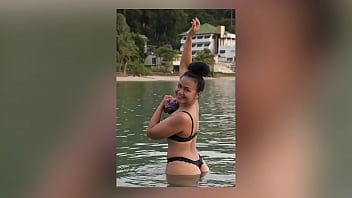 Babe Models A Thong At The Beach thumbnail
