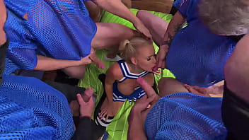 Cheerleaders warm up football players with a blowbang before the gangbang